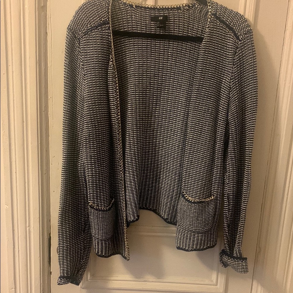 Black and white jacket with gold metal trim